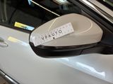 a sticker on the side mirror of a car
