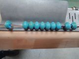 a close up of a machine that has beads on it
