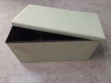 a box that has a lid on it on the floor