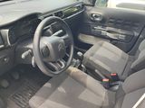 a car with a steering wheel and a dash board