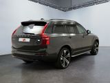 the back of a grey volvo suv parked in a garage
