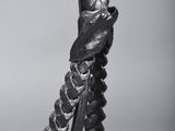 a close up of a metal sculpture of a snake