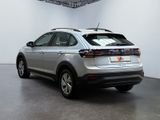 the rear end of a silver volkswagen suv parked in a white room