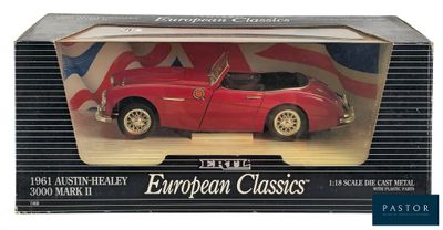 an image of a red toy car in a box with a flag on it