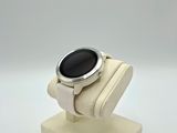 an image of a smart watch sitting on top of a display stand