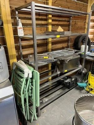 a metal shelf with a lot of items on it