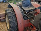 a tractor that is sitting in the dirt