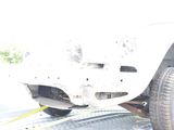 a white truck that is being towed by a tow truck
