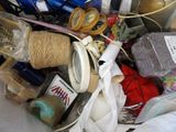a pile of assorted items in a bin on the floor