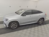 the mercedes gle suv is parked in a clean garage