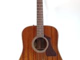 a close up of a guitar on a stand against a white background