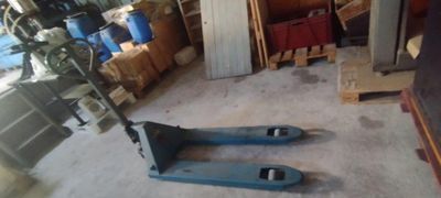 two forks that are sitting on the floor in the garage