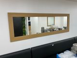 a picture of a dining room with a large mirror on the wall