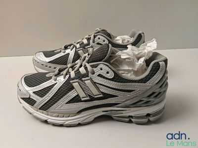 a pair of new balance running shoes on a table