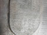 a close up of a piece of metal with a hole in it