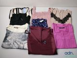 a lot of clothes that are sitting on a table