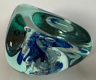 a glass bowl with a blue and green design on it
