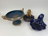a blue bowl and a blue plate on a white table