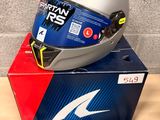 a helmet on top of a box on a table