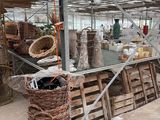 many baskets and baskets on display inside of a building