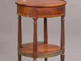 a small wooden table with a shelf on top of it