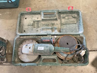 a tool box with tools in it sitting on the floor