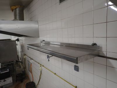 an image of a kitchen with a sink and a stove
