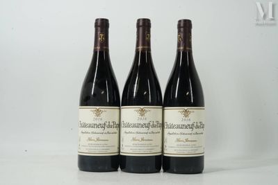 three bottles of wine sitting on top of a white table