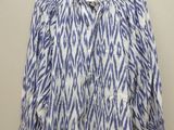 a white and blue shirt with a zebra print pattern on it
