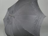 a black umbrella that is open on a white background