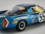 a model of a blue race car on a white surface