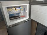 an open refrigerator with a lot of food inside of it