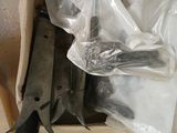 many pairs of scissors sitting in a box on the floor