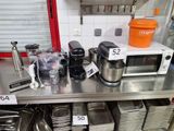 a lot of cooking utensils on the kitchen counter