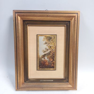 une photo d'une photo d'un tableau dans un cadre en bois