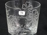 a close up of a glass cup with a number on it