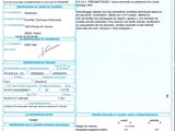 un gros plan d'un document sur lequel figure la photo d'une personne