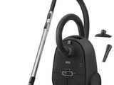 a black vacuum cleaner with a hose and other accessories