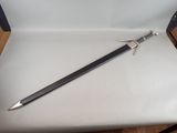 a sword that is sitting on a chair on the floor