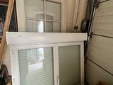 a window in the corner of a room next to a box