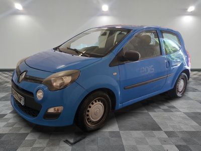 a picture of a small blue car parked in a garage