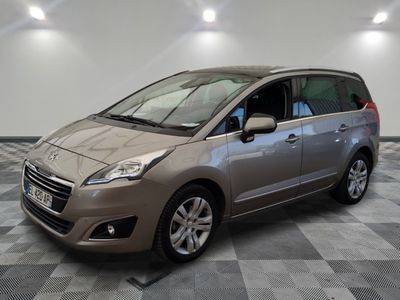 a picture of a silver minivan parked in a garage