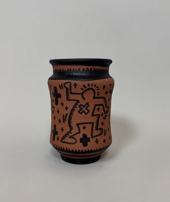a close up of a vase with a design on it