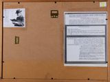 a bulletin board with a picture of a man on it