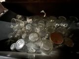 a pile of empty plastic cups in the sink