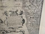 a picture of a map in a frame on a table