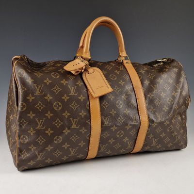 Sac Keepall Louis Vuitton en toile Monogram et cuir