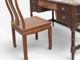 a wooden desk with a glass top and a chair in front of it