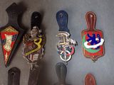 many different types of badges on a table