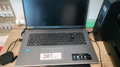 a laptop that is sitting on a desk next to a printer